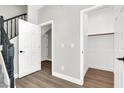 Entryway featuring a staircase and closet with light gray walls and light wood-look floors at 9116 Vista Greens Way # 104, Las Vegas, NV 89134