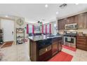 Gourmet kitchen with stainless steel appliances, granite countertops, and ample cabinet space at 9118 Mount Wilson St, Las Vegas, NV 89113