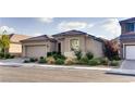 Attractive single-story home featuring desert landscaping, a tile roof, and an attached two-car garage at 9537 Wild Valley Ave, Las Vegas, NV 89148