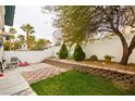 Private backyard featuring a concrete patio and tiered garden beds at , Las Vegas, NV 89145