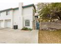 White two-story townhome with a private fenced courtyard area at , Las Vegas, NV 89145