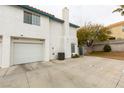 Two-story townhome featuring an attached garage and private courtyard entry at , Las Vegas, NV 89145