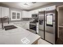 Modern kitchen featuring stainless steel appliances, quartz countertops, and ample cabinet space at 10291 Delta View Ct # 101, Las Vegas, NV 89129