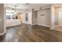 Open concept living space with wood-look flooring and ample natural light at 10291 Delta View Ct # 101, Las Vegas, NV 89129