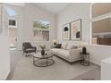 Bright and airy living room featuring high ceilings, modern decor, and views of the sparkling backyard pool at 10680 Sapphire Vista Ave, Las Vegas, NV 89144