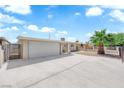 Attractive single-level home featuring low-maintenance landscaping and a spacious driveway at 1628 Patricia St, North Las Vegas, NV 89030