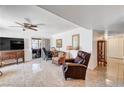 A well-lit living area has tile floors, neutral walls, and multiple seating arrangements at 2725 S Nellis Blvd # 1037, Las Vegas, NV 89121