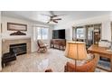 The spacious living room features a fireplace, tile flooring, and natural light at 2725 S Nellis Blvd # 1037, Las Vegas, NV 89121