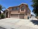 Charming two-story home featuring a three-car garage and a well-maintained front yard at 2728 Aspen Wood Ave, Henderson, NV 89074