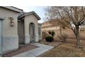 Close-up of front yard showcasing desert landscaping, a walkway and address at 3021 New Journey Way, North Las Vegas, NV 89031