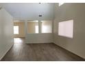Bright living room with tall ceilings and wood-look flooring at 3021 New Journey Way, North Las Vegas, NV 89031