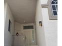 Entryway to unit with secure door, overhead lighting, and a decorative wreath at 3125 N Buffalo Dr # 2104, Las Vegas, NV 89128