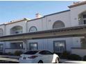 Apartment complex featuring covered parking, neutral color scheme, and well-kept landscaping at 3125 N Buffalo Dr # 2104, Las Vegas, NV 89128