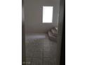 Cozy room with tile floors, base trim and plenty of natural light at 3644 Starlight Evening St, Las Vegas, NV 89129