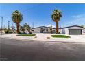 Charming home featuring desert landscaping, palm trees, and a modern design at 3647 Ottawa Cir, Las Vegas, NV 89169