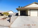 Exterior view of a charming home with a covered car port and a well kept garden at 4382 Pinegrove St, Las Vegas, NV 89147