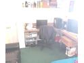 Cluttered bedroom with desk, computer, and disorganized shelves at 508 Tara Ct, Boulder City, NV 89005