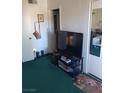 Standard bedroom layout with television, dresser, and basic decor, with carpet at 508 Tara Ct, Boulder City, NV 89005
