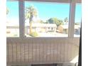 Bright view of palm trees and adjacent houses through the window at 508 Tara Ct, Boulder City, NV 89005