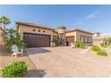 Lovely single-story home featuring a spacious three-car garage and desert landscaping at 5576 Buena Martina Way, Las Vegas, NV 89141