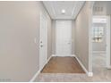 Open hallway features tile entry, plush carpeting, high ceilings and easy access to other rooms at 589 Via Paladini, Henderson, NV 89011