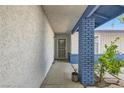 Welcoming front entrance featuring a decorative security door, brick column and fresh landscaping at 6309 Miraloma St, Las Vegas, NV 89108