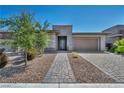 Well maintained single story home with desert landscaping, stone accents and a spacious two-car garage at 6684 Regency Stone Way, Las Vegas, NV 89148