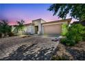 Well maintained single story home with mature desert landscaping, stone accents and a spacious two-car garage at 6684 Regency Stone Way, Las Vegas, NV 89148