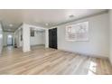 Bright living room features wood-look floors and an open floor plan perfect for entertaining at 825 Cornerstone Pl, North Las Vegas, NV 89031