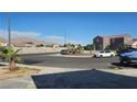 Exterior shot of street corner near two story home with mountain in distance on sunny day at 845 Bladensburg St, Las Vegas, NV 89110