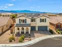 Inviting two-story home showcasing a beautiful desert landscape and mountain views in the background at 8925 Kenzie Cove St, Las Vegas, NV 89131