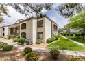 A well maintained exterior featuring stucco, rock landscaping, and a walkway at 950 Seven Hills Dr # 524, Henderson, NV 89052