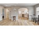 Open-concept living room with hardwood floors, an arched doorway, and a modern color scheme at 1017 E Oakey Blvd, Las Vegas, NV 89104