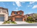 Inviting two-story home with a two-car garage and desert landscaping in an attractive neighborhood at 174 Augusta Course Ave, Las Vegas, NV 89148