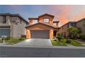 Charming two-story home with a two-car garage, desert landscaping, and welcoming curb appeal at 174 Augusta Course Ave, Las Vegas, NV 89148