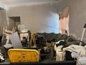 Untidy living room featuring a couch and clutter at 1955 Raindance Way, Las Vegas, NV 89169