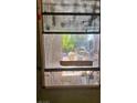 Close-up of window showing its condition and view to the home's exterior at 1955 Raindance Way, Las Vegas, NV 89169