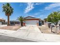 Single-story home boasting desert landscaping, and an attached garage at 2116 Cameron St, Las Vegas, NV 89102