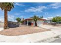 Charming home featuring desert landscaping, an attached garage, and mature trees at 2116 Cameron St, Las Vegas, NV 89102