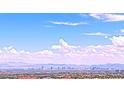 Expansive Las Vegas city view with mountains and clear blue sky at 2194 Pigeon Hawk St, Las Vegas, NV 89138