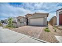 Attractive single-Gathering home showcasing a brick driveway, low-maintenance landscaping, and modern architectural design at 2194 Pigeon Hawk St, Las Vegas, NV 89138