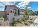 Beautifully landscaped front yard with a well-maintained lawn and neutral tones, enhancing the curb appeal at 2194 Pigeon Hawk St, Las Vegas, NV 89138