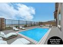 Virtually staged backyard features a sparkling pool, lounge chairs, and an outdoor seating area with views at 2194 Pigeon Hawk St, Las Vegas, NV 89138