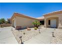 The exterior front of the property featuring desert landscaping, pathway, and the front door at 2545 Banora Point Dr, Las Vegas, NV 89134