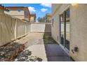 Backyard with a privacy fence and potential for customization; perfect for outdoor living and entertaining at 3961 Bayamon St, Las Vegas, NV 89129