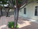 Paver patio with shade trees lining the house at 4113 Arcola Ave, Las Vegas, NV 89110