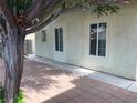 Paver patio with shade trees lining the house at 4113 Arcola Ave, Las Vegas, NV 89110
