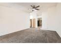 Bright living room featuring neutral walls and carpet at 4611 Four Leaf Clover Dr, Las Vegas, NV 89122