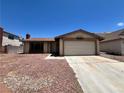 Single-story home featuring a two-car garage and low maintenance landscaping at 4766 Knollwood Dr, Las Vegas, NV 89147