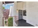 This is an entryway featuring a security gate and access to the home's interior at 5063 Eldora Ave # 4, Las Vegas, NV 89146